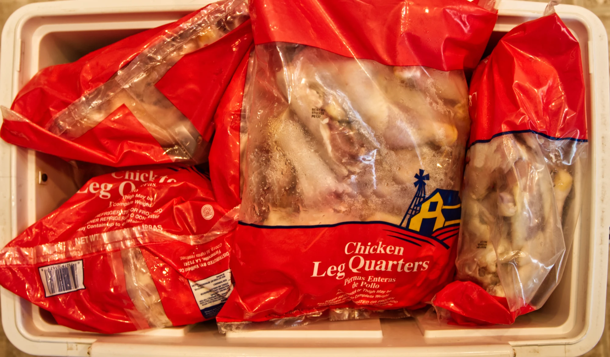 Ten-pound bags of raw chicken leg quarters